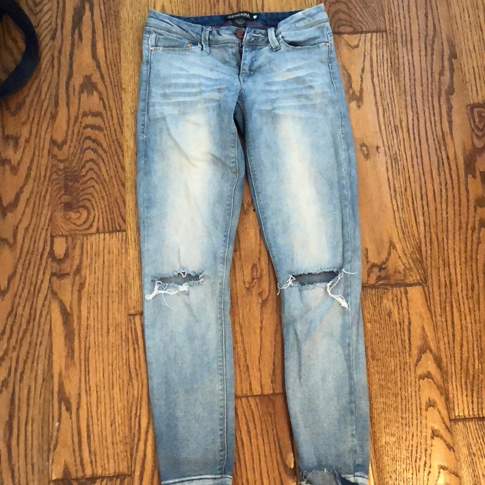 ripped at the knee light wash skinny jeans